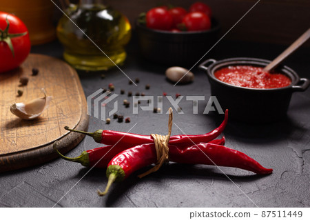 Chile pepper and tomato sauce ingredient for homemade cooking on table. Recipe concept Chile pepper and tomato sauce ingredient for homemade cooking on table. Recipe concept 87511449