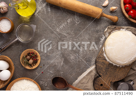 Pizza homemade cooking or baking at table. Dough pizza on slate background 87511490
