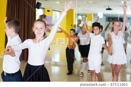 Children enjoying of partner dance Children enjoying of partner dance 87511801