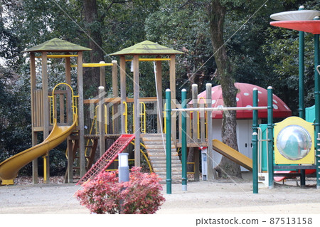 A landscape of a forest of green leaves and a park with lots of playset 87513158