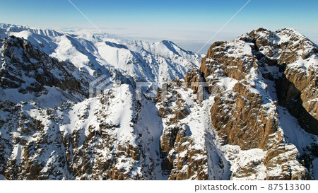 Drone view of the high snowy peaks of Kazakhstan 87513300