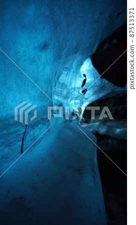 An ice cave of incredible beauty. Blue gradient 87513371