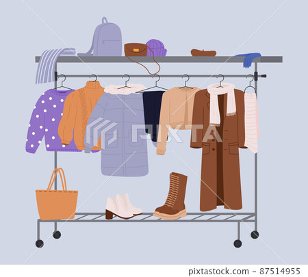 Stylish fashion clothes hanging on hangers on garment rack or rail. Fashion clothes and accessories on hanger rail. Fall, winter garments, footwear and bags. Women capsule wardrobe on racks. Stylish fashion clothes hanging on hangers on garment rack or rail. Fashion clothes and accessories on hanger rail. Fall, winter garments, footwear and bags. Women capsule wardrobe on racks. 87514955
