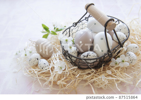 A basket with Easter eggs A basket with Easter eggs 87515864