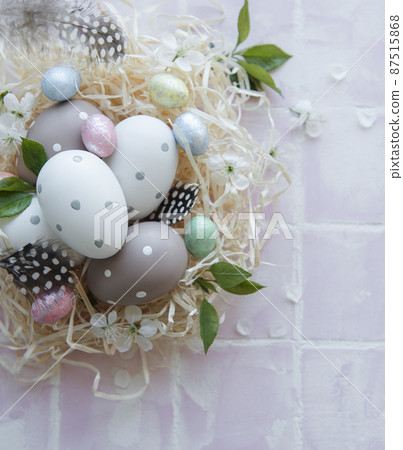 Easter eggs in straw nest Easter eggs in straw nest 87515868