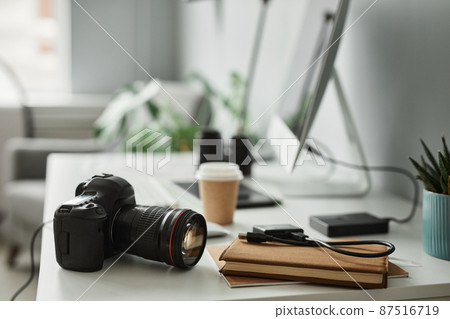 Camera on Photographers Workplace Camera on Photographers Workplace 87516719