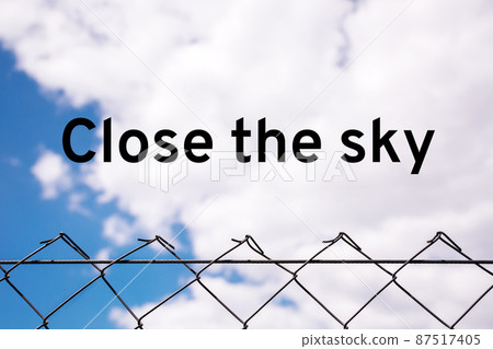 Close the sky over Ukraine. Metal mesh covers the sky over peaceful people. Concept of freedom and independence. Close the sky over Ukraine. Metal mesh covers the sky over peaceful people. Concept of freedom and independence. 87517405