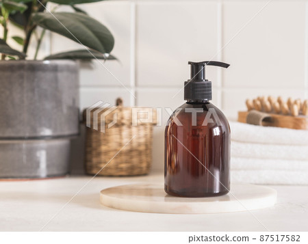 Brown bottle mockup for bathing products in bathroom 87517582
