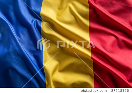 Waving flag of Romania. National symbol of country and state 87518536