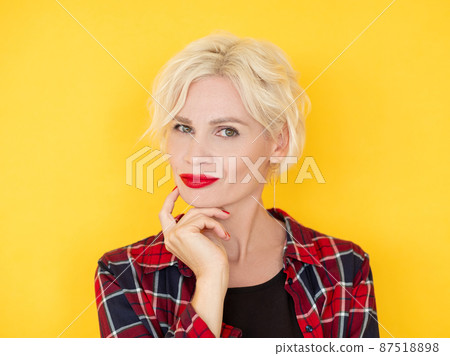Puzzled woman. Uncertain situation. Think over problem. Doubtful middle-aged lady considering idea holding hand on chin isolated yellow. Puzzled woman. Uncertain situation. Think over problem. Doubtful middle-aged lady considering idea holding hand on chin isolated yellow. 87518898