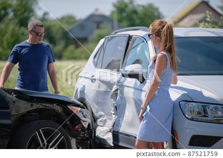 Drivers of smashed vehicles arguing who is guilty in car crash accident on street side. Road safety and insurance concept 87521759