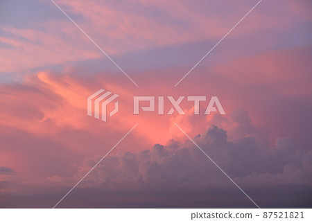 Colorful evening landscape with soft pastel coloured cloudscape on watercolor tinted sunset sky. Abstract nature background 87521821