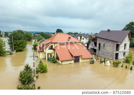 Aerial view of flooded houses with dirty water of Dnister river in Halych town, western Ukraine. Aerial view of flooded houses with dirty water of Dnister river in Halych town, western Ukraine. 87522080