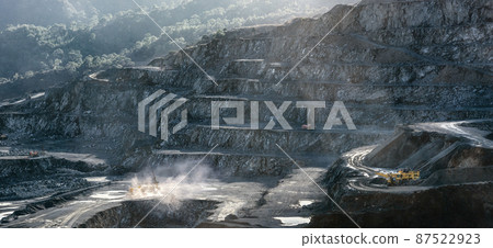 Stone drilling and crushing machines working in diabase quarry Stone drilling and crushing machines working in diabase quarry 87522923