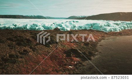 glacier flow through the mountains in Iceland 87523031