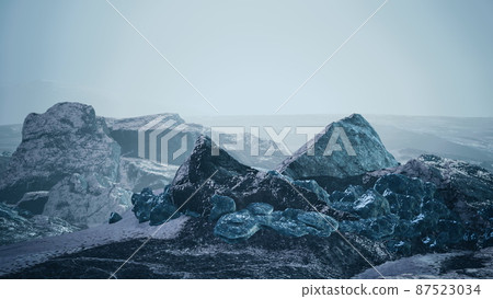 snow ice and rocks at northern landscape 87523034