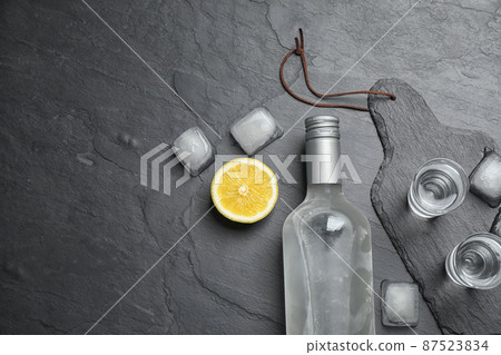 Flat lay composition with cold Russian vodka on black table 87523834