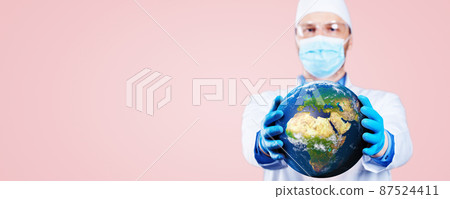 Doctor hold a earth globe in hands and a medical syringe with vaccine against corona virus. 3D rendering. Elements of this image furnished by NASA. 87524411