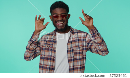 Crazy man in fashion shirt demonstrating tongue out fooling around, making silly faces, madness Crazy man in fashion shirt demonstrating tongue out fooling around, making silly faces, madness 87525461