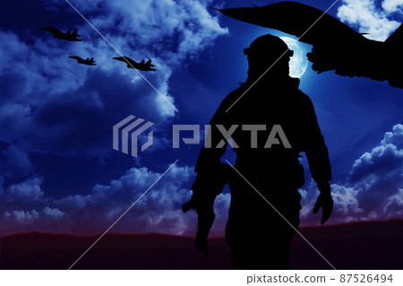 War concept. Silhouette of a soldier at night with full military equipment in a dangerous military area.Selective focus War concept. Silhouette of a soldier at night with full military equipment in a dangerous military area.Selective focus 87526494