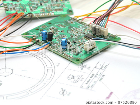 Old semiconductor / repair image placed on the blueprint of the pendulum clock 87526880