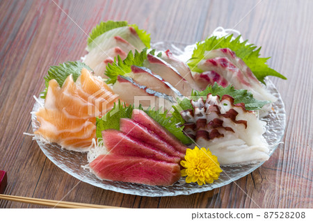 Sashimi on a glass plate 87528208