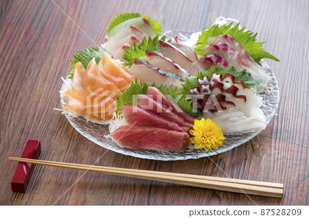 Sashimi on a glass plate 87528209