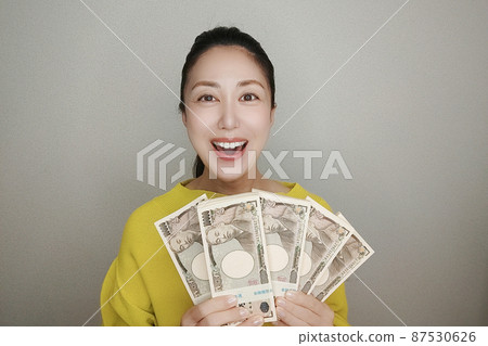 A woman holding a bundle 87530626