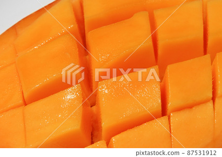 Summer tradition: ripe mango with flower cutting Summer tradition: ripe mango with flower cutting 87531912