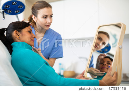 Woman having consultation at aesthetic medicine clinic Woman having consultation at aesthetic medicine clinic 87535456