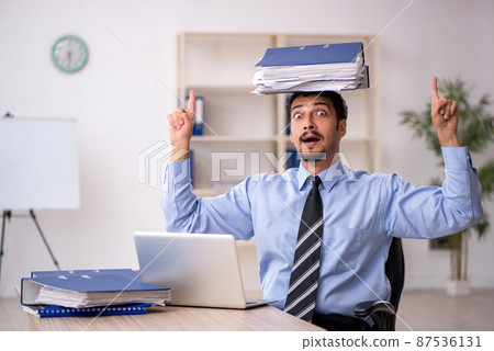 Young male employee working in the office 87536131