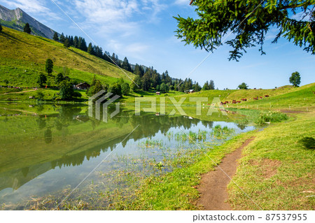 Lake of the Confins and Mountain landscape in La Clusaz, France 87537955