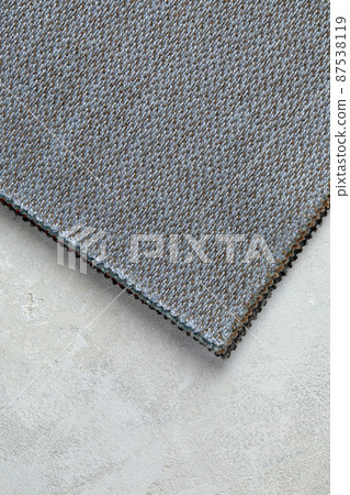 abstract texture of rough cotton fabric or canvas with drawing from fibers a cross crosswise for backgrounds of gray color abstract texture of rough cotton fabric or canvas with drawing from fibers a cross crosswise for backgrounds of gray color 87538119