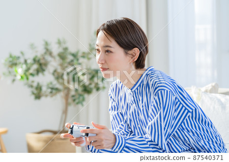 Game hobby enthusiastic woman Game hobby enthusiastic woman 87540371