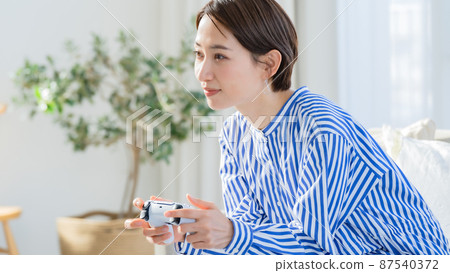 Game hobby enthusiastic woman Game hobby enthusiastic woman 87540372