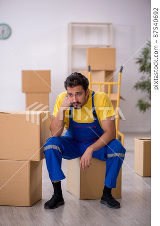 Young male contractor doing home relocation Young male contractor doing home relocation 87540692