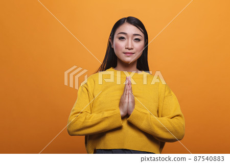 Spiritual religious beautiful woman praying in silence and devotion to achieve enlightenment. Spiritual religious beautiful woman praying in silence and devotion to achieve enlightenment. 87540883