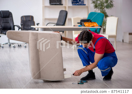 Young male carpenter working at workshop Young male carpenter working at workshop 87541117