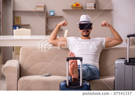 Young man preparing for trip at home 87541157