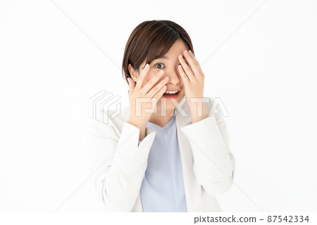 A woman who covers her eyes A woman who covers her eyes 87542334