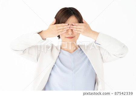 A woman who covers her eyes A woman who covers her eyes 87542339