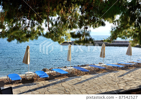 Sunbeds on the beach at luxury hotel, Peloponnes, Greece Sunbeds on the beach at luxury hotel, Peloponnes, Greece 87542527