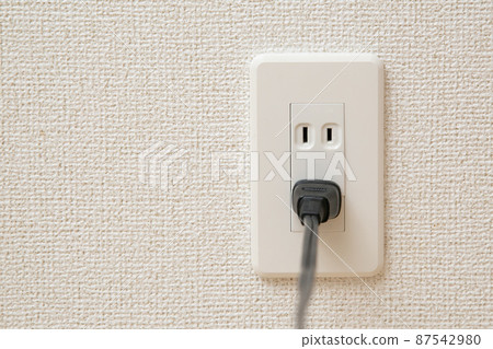 Outlet with a cord stuck in it Outlet with a cord stuck in it 87542980