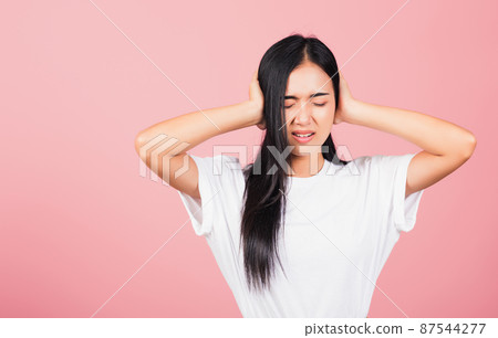 woman have closed ears with hand palms and close eyes woman have closed ears with hand palms and close eyes 87544277