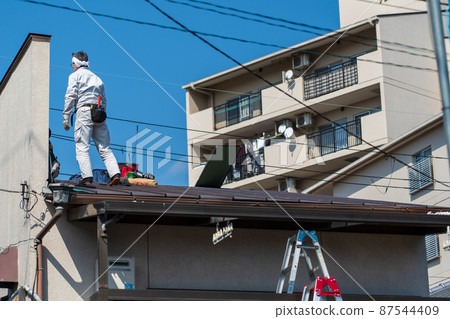 Damaged roof of an old private house 87544409