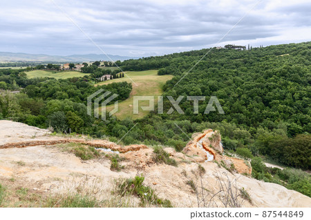 Hot thermal spring of Bagno Vignoni falling down. Val d'Orcia, Tuscany, Italy Hot thermal spring of Bagno Vignoni falling down. Val d'Orcia, Tuscany, Italy 87544849