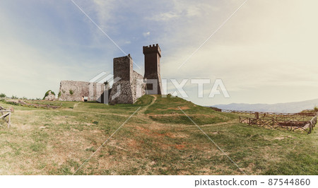Panoramic view to Rocca of Radicofani on grass hilltop with vintage effect, Tuscany, Italy Panoramic view to Rocca of Radicofani on grass hilltop with vintage effect, Tuscany, Italy 87544860