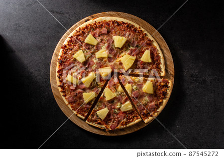 Hawaiian pizza with pineapple,ham and cheese 87545272