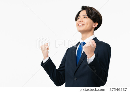 A young businessman who poses a gut A young businessman who poses a gut 87546387