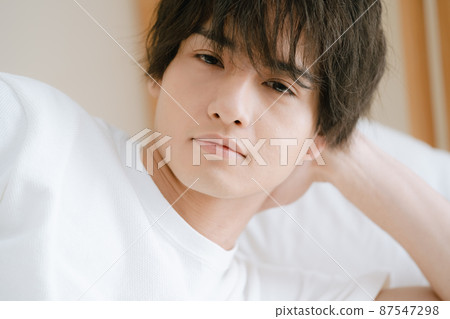 A young man who is sick due to lack of sleep 87547298